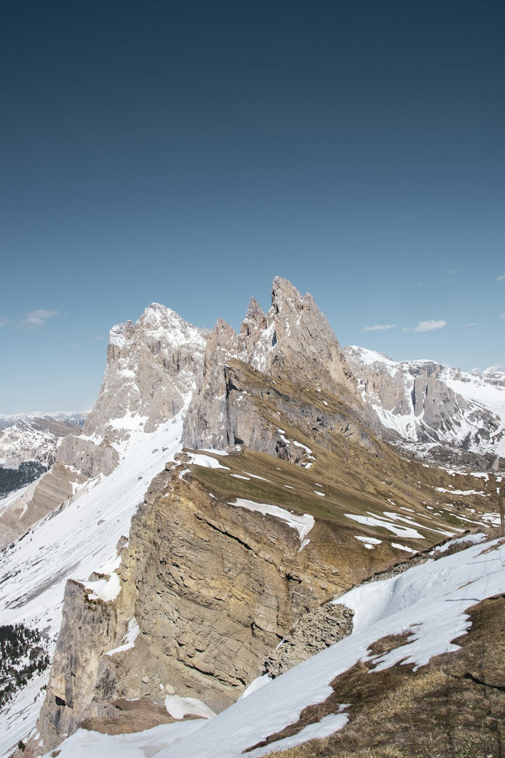 brown and white rocky mountain under blue sky during daytime