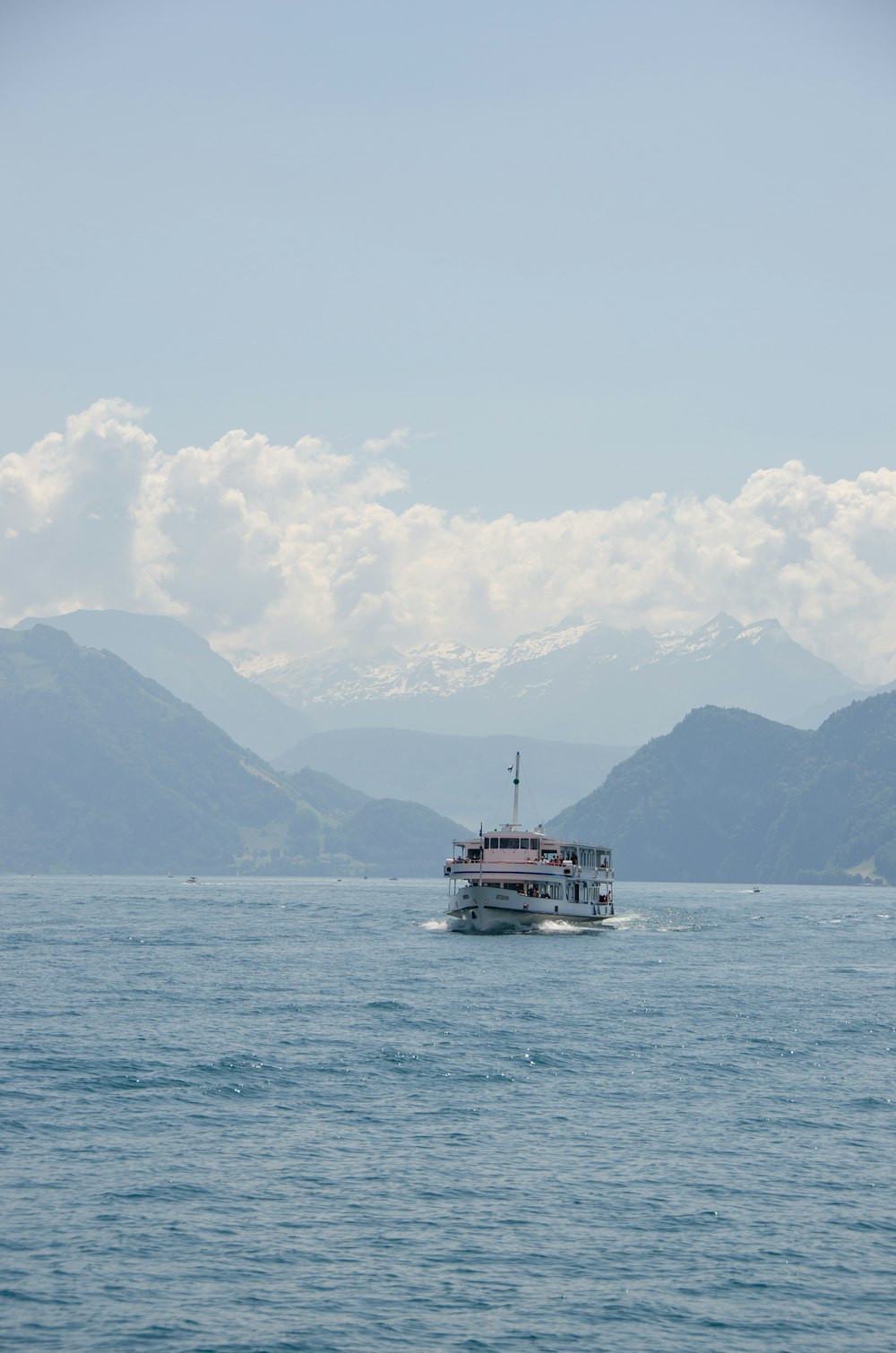 white and red boat on sea during daytime