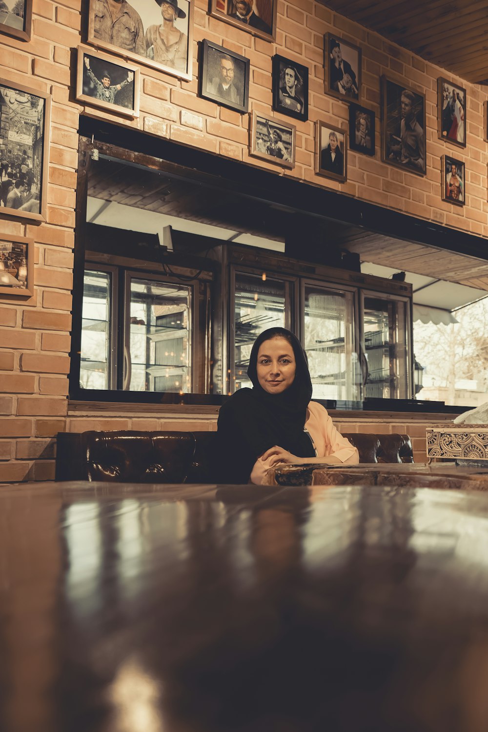 woman in black long sleeve shirt sitting on chair