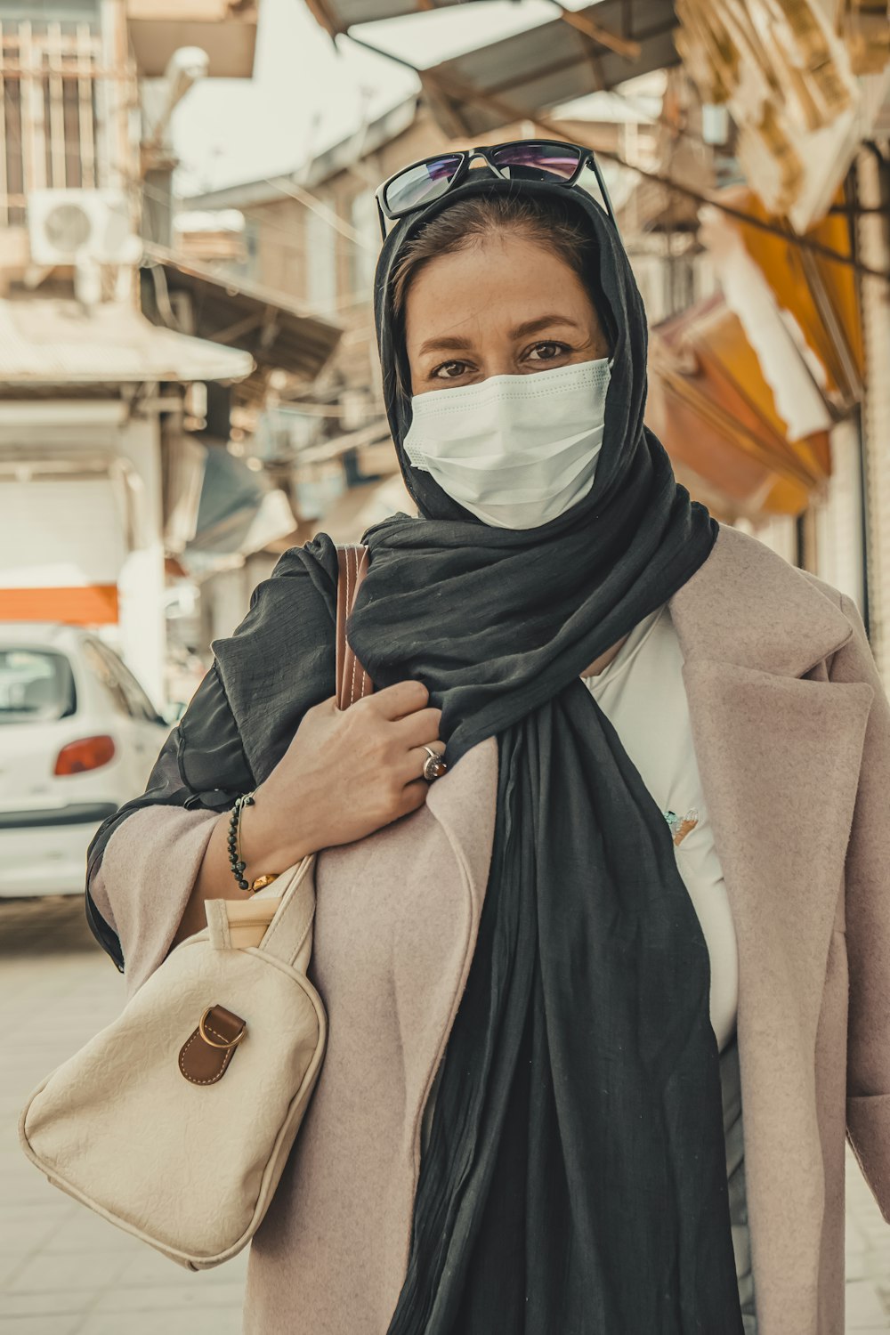 woman in black hijab and gray abaya