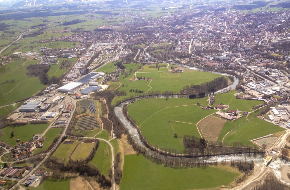 aerial view of green grass field and trees during daytime