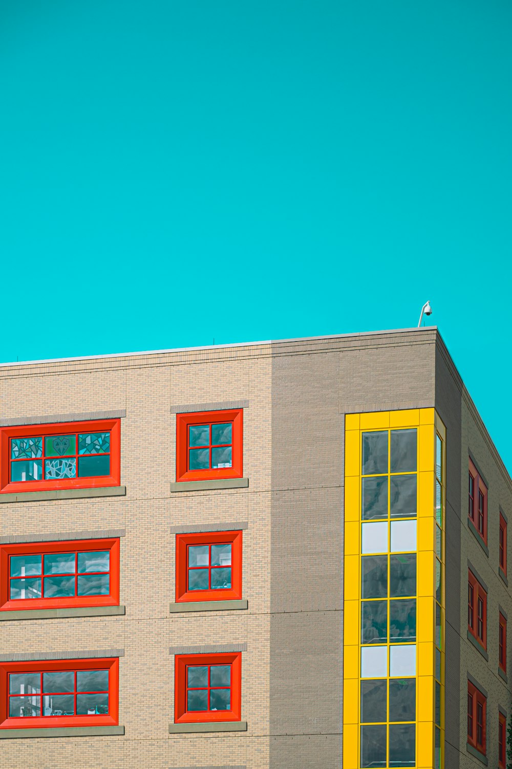 brown and beige concrete building under blue sky during daytime