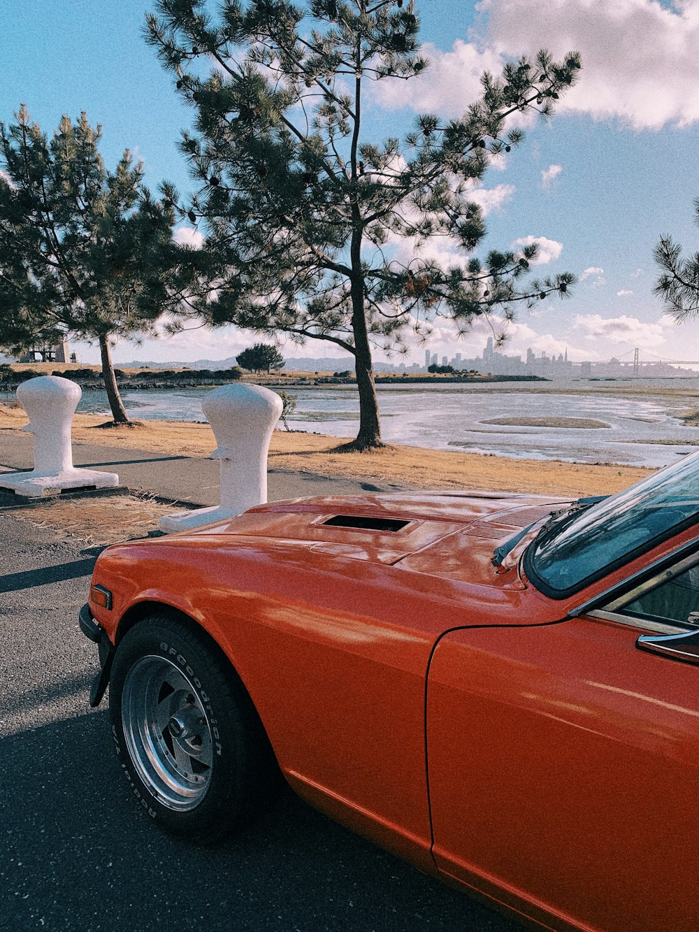 orange car on road during daytime