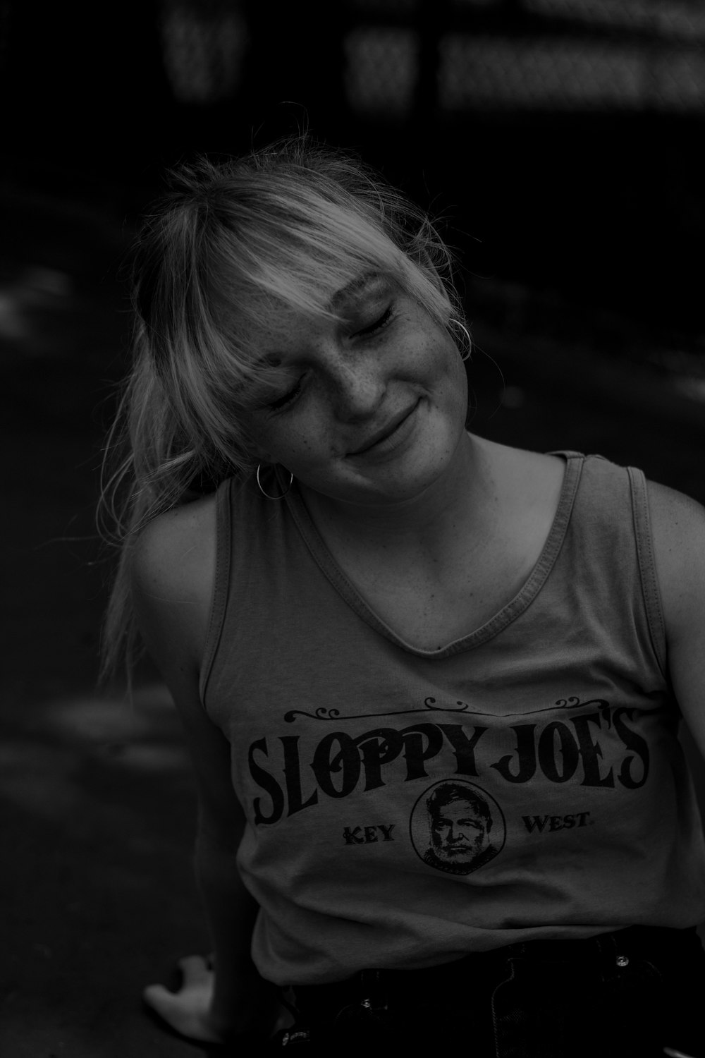 woman in tank top grayscale photo