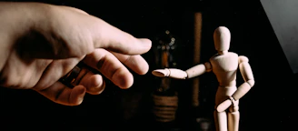 person holding white and brown cigarette stick