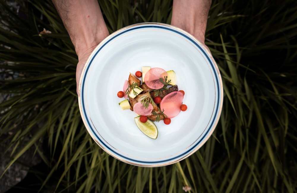 red fruit on white round plate