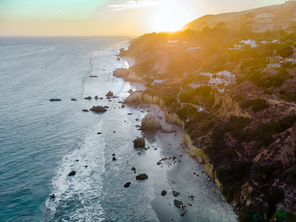 body of water during sunset