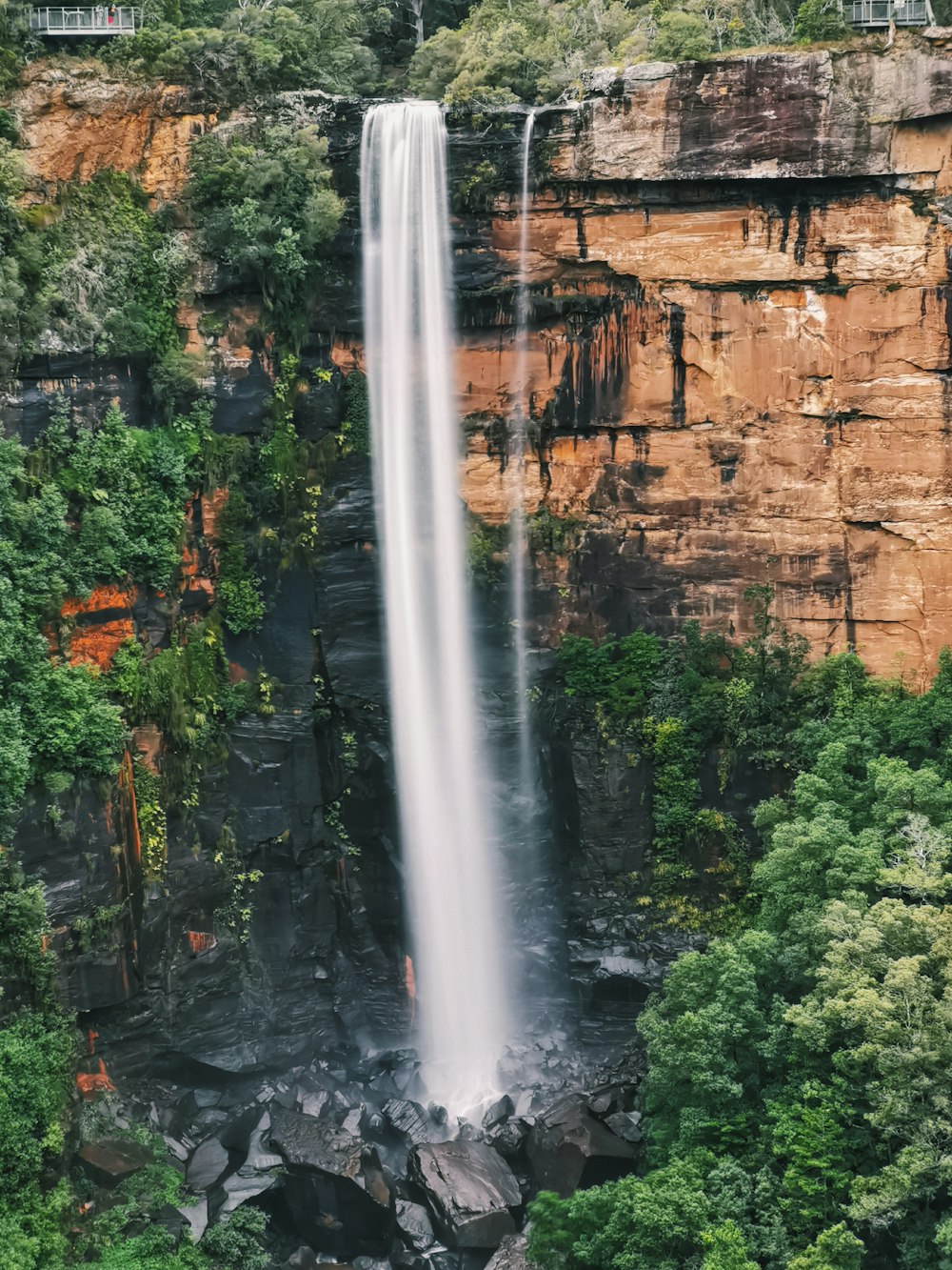 waterfalls in the middle of the forest