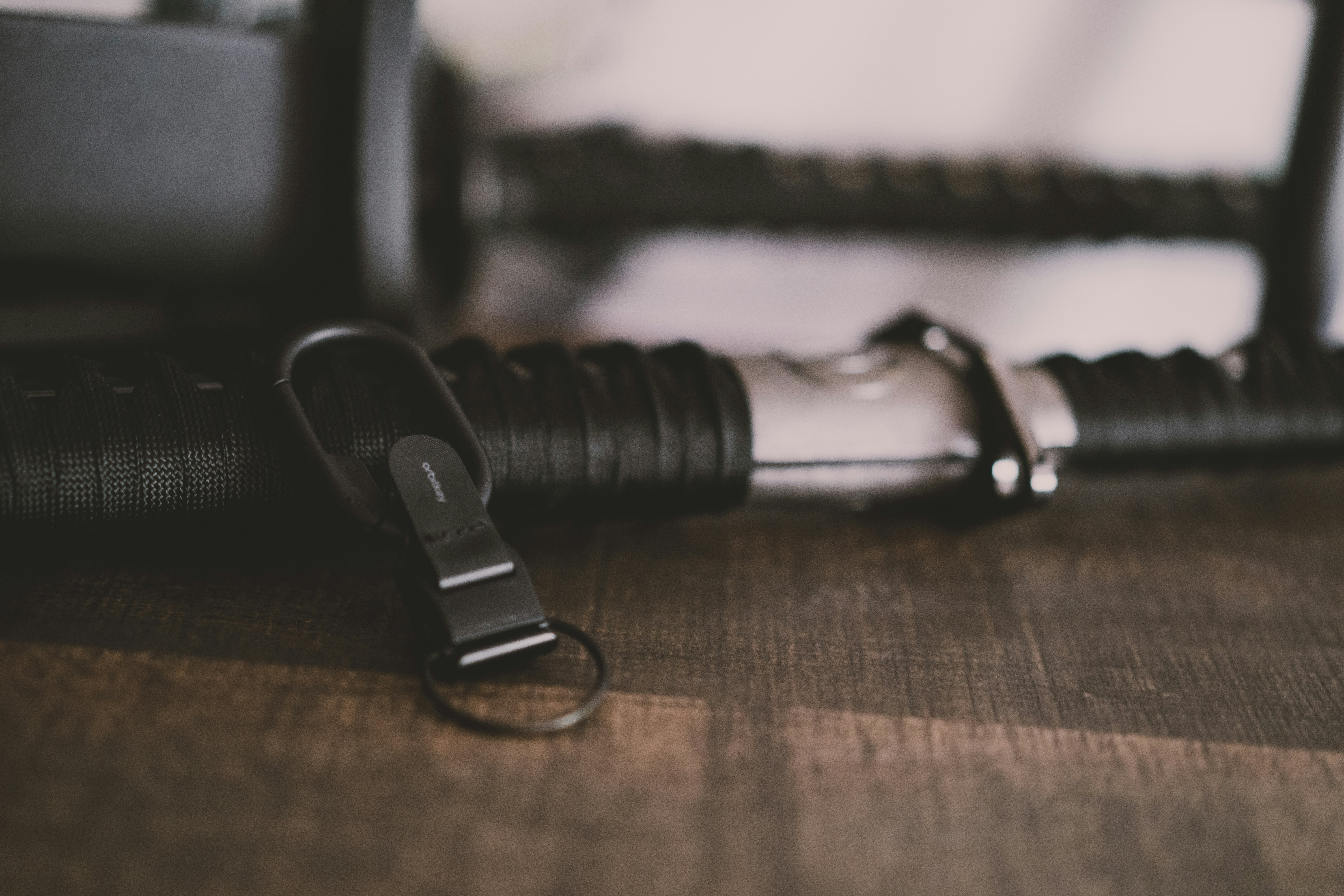 black and silver strap on brown wooden table