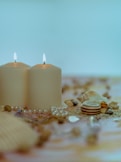 white candles on brown wooden table
