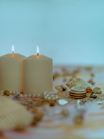A calm sea green and gold-themed Reiki session setting with soft candlelight and healing crystals.