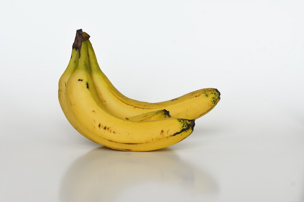 yellow banana on white table