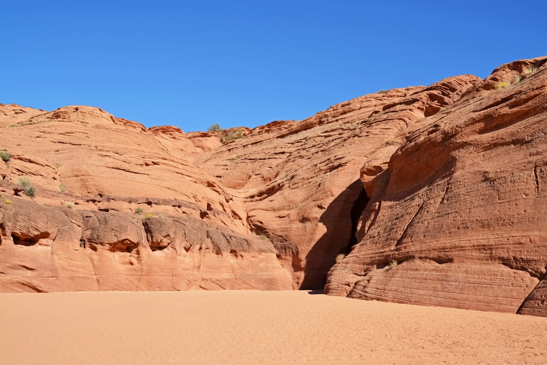 brown rocky mountain under blue sky during daytime