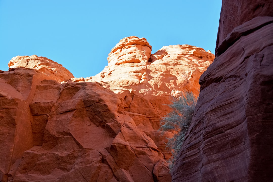 brown rocky mountain under blue sky during daytime