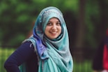 woman in blue hijab and black long sleeve shirt