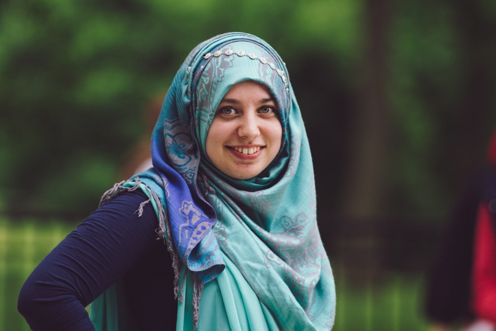 woman in blue hijab and black long sleeve shirt