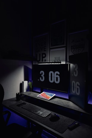 Minimalist office environment with a screen highlighting cost reduction metrics.