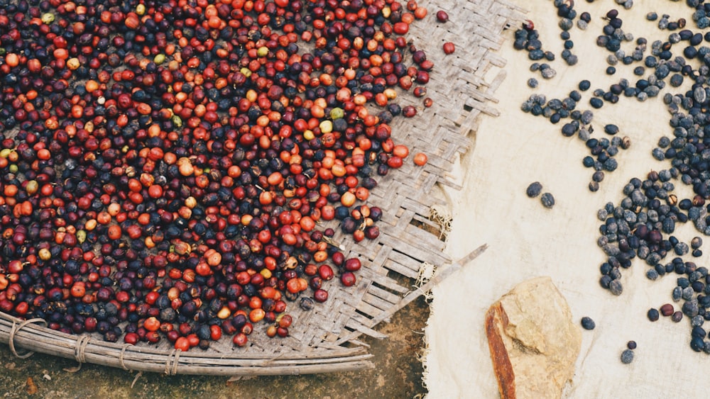 orange and red round fruits on black round tray