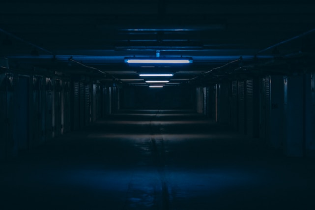 empty hallway with lights turned on during night time
