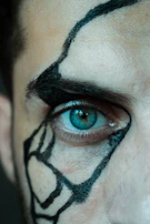 Detailed close-up of a realistic eye tattoo with subtle highlights.