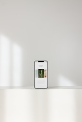 silver iphone 6 on white table