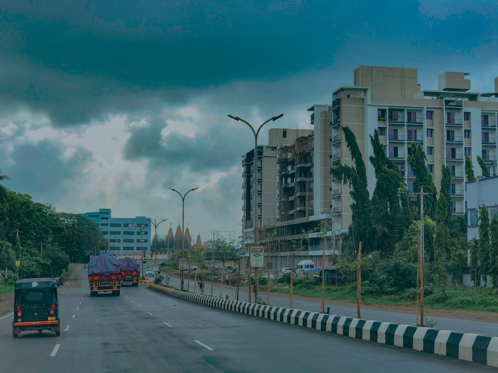 cars on road near buildings during daytime