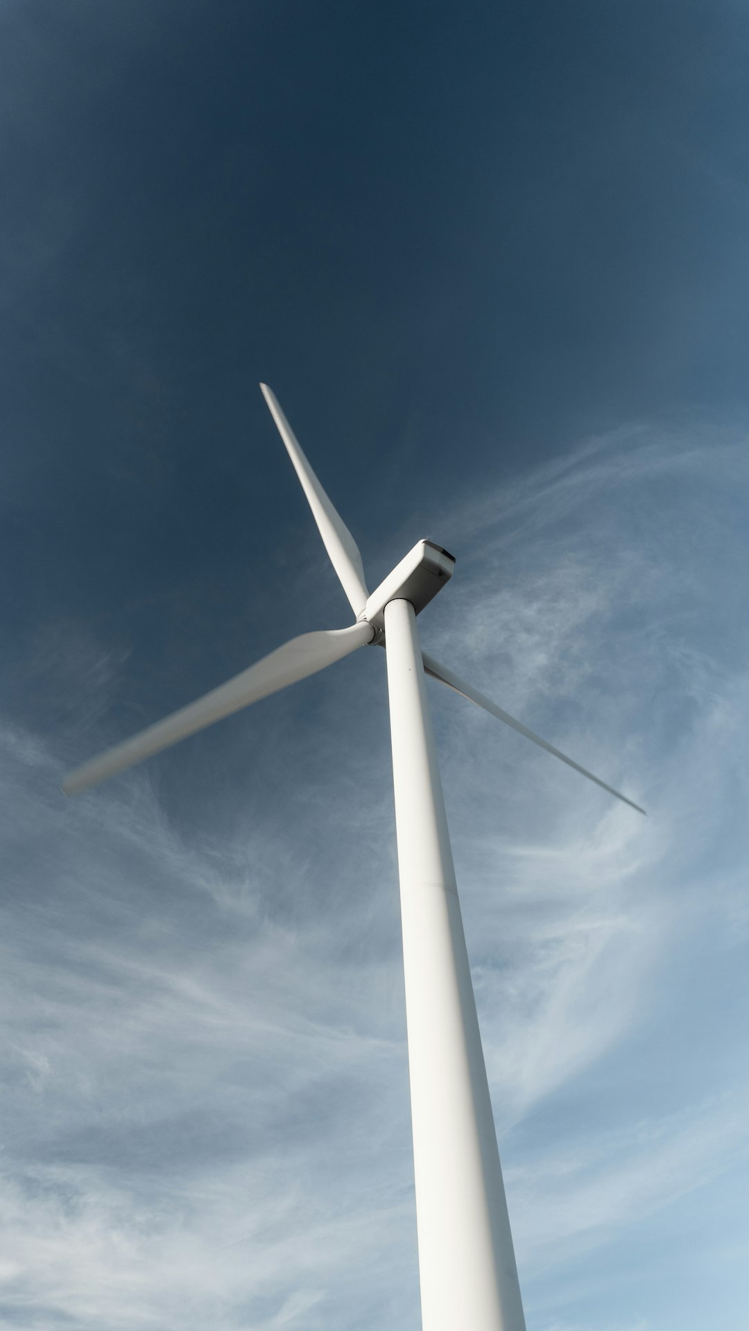 white windmill under blue sky during daytime