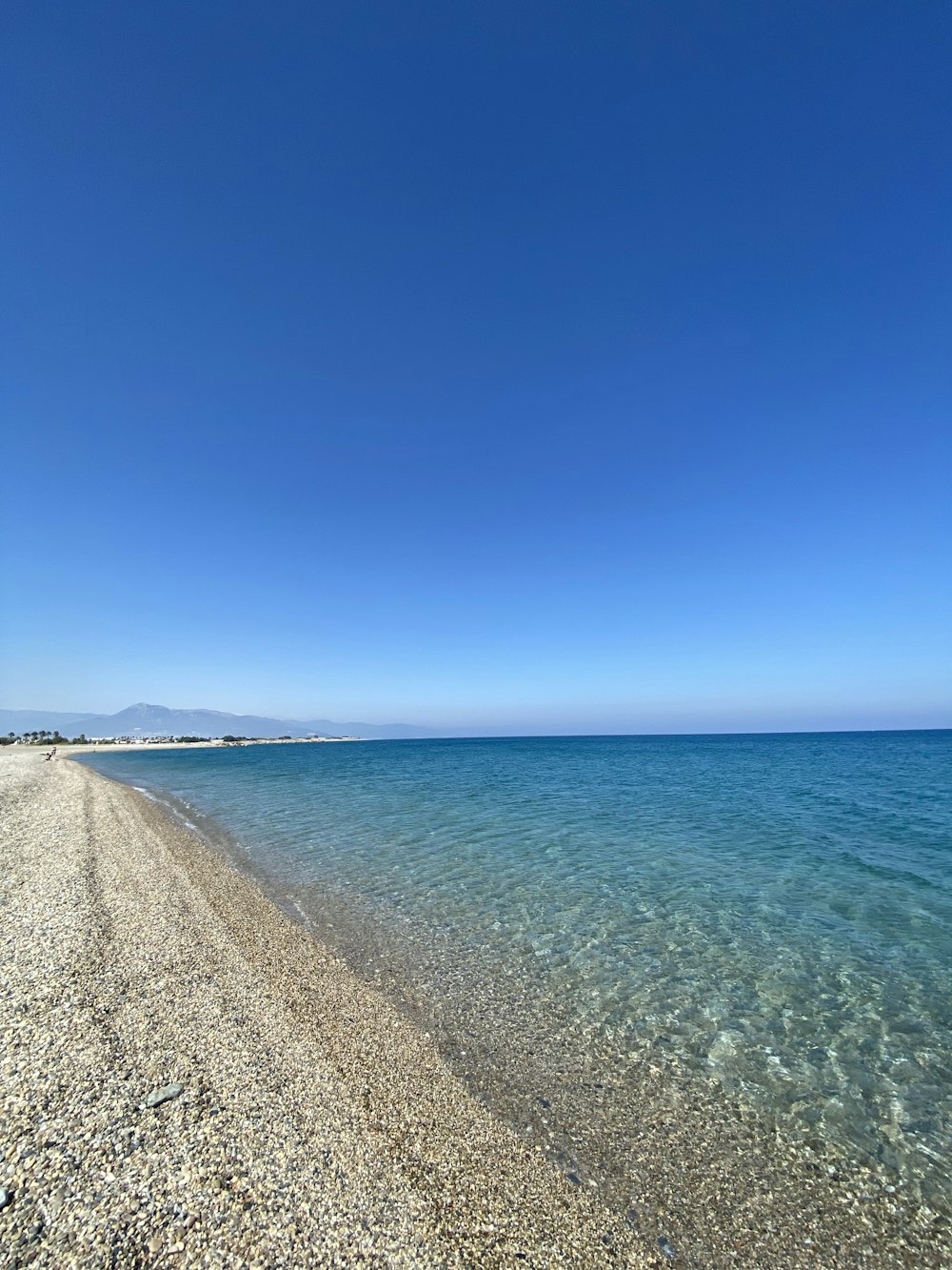 blue ocean water under blue sky during daytime