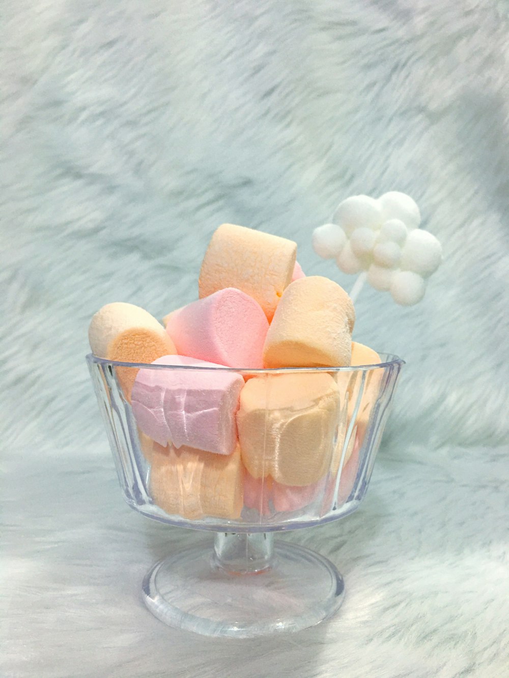 brown and white heart shaped cookies in clear glass bowl