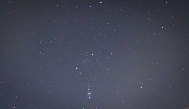 Illustration of the Gemini twins constellation shining brightly in a night sky.