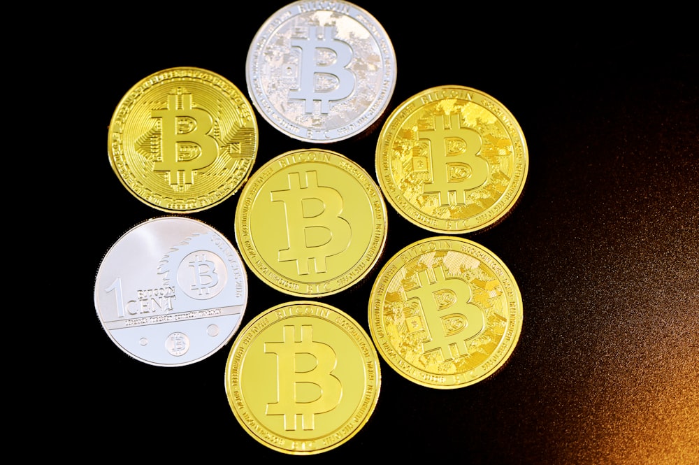 gold round coins on black background