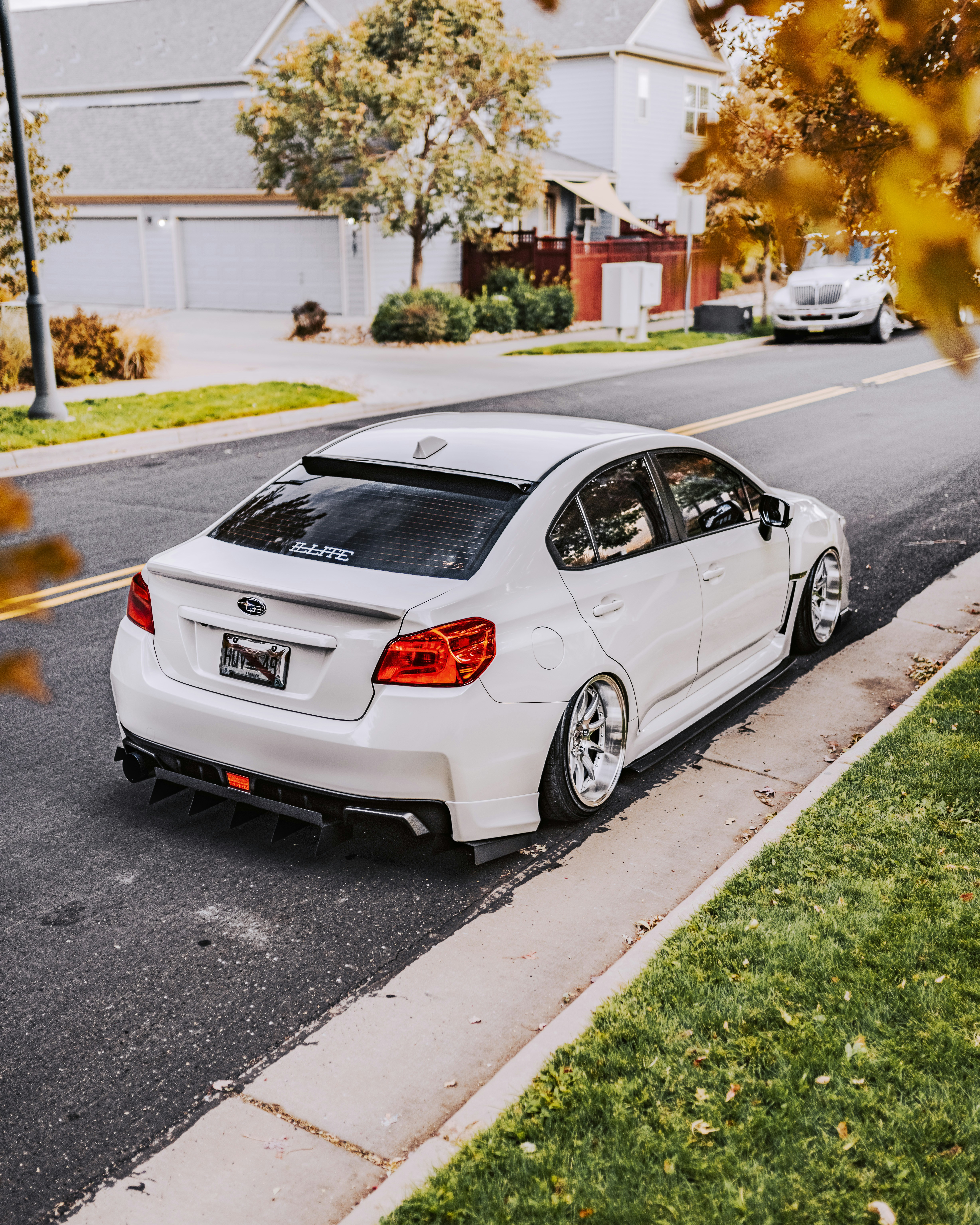 white honda sedan on road during daytime