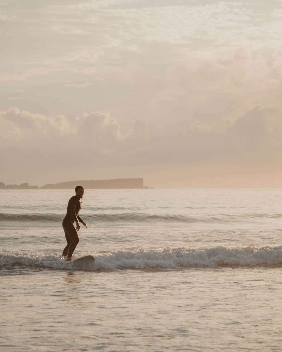 woman in black bikini on beach during sunset