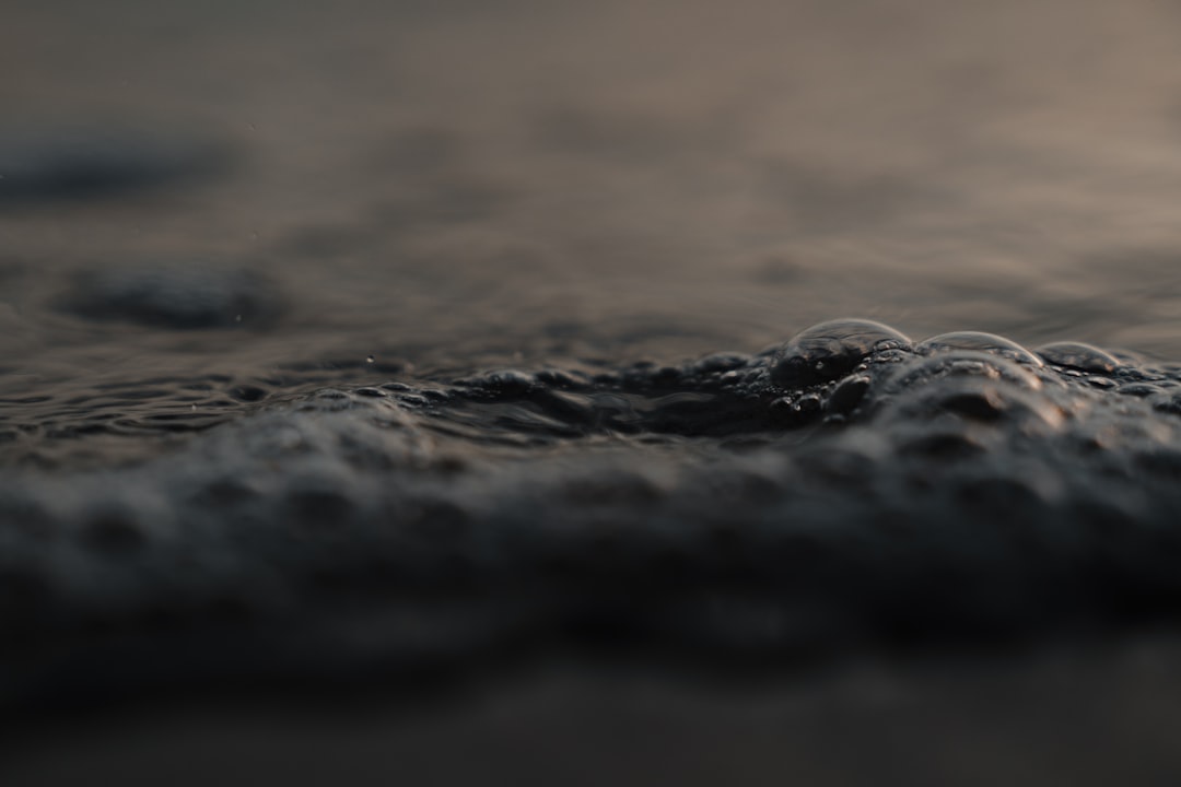 black stones on brown sand