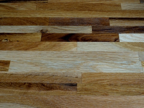 A close-up of intricate wood designs on flooring.