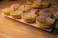 Delightful pastries arranged on a rustic wooden table.