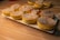 Close-up of assorted fresh bakery goods on a wooden table.