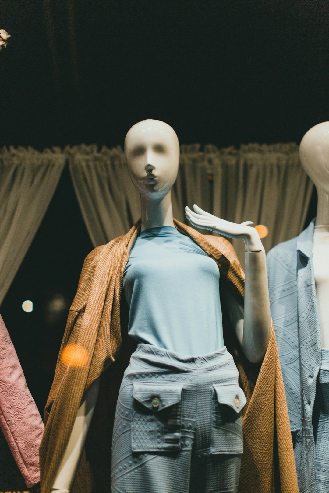 mannequin in white sleeveless dress