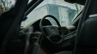 Before and after shots of a car’s interior showing dust and stains versus a pristine, detailed cabin.