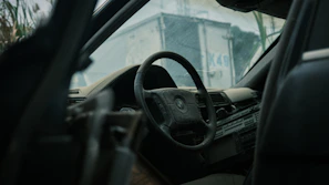 Before and after comparison of a car interior with visible dirt removed