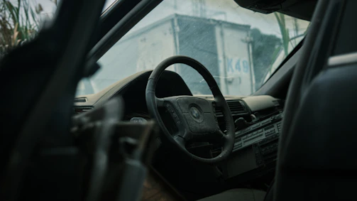 Before and after side-by-side of a dusty SUV’s interior, now spotless and refreshed.