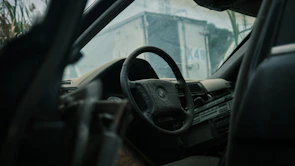 Interior of a vehicle showing transformation from dusty to spotless after cleaning.