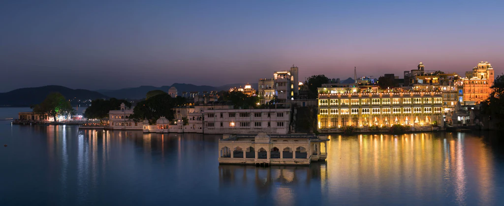 Lake Pichola and the Udaipur waterfront lit up at night