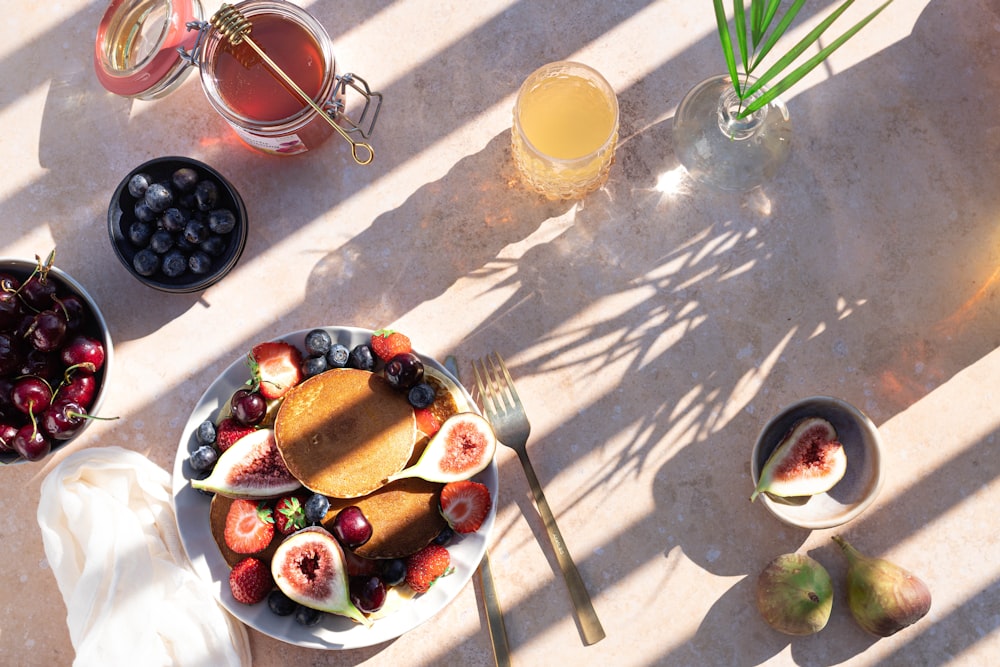 sliced fruits on white ceramic plate