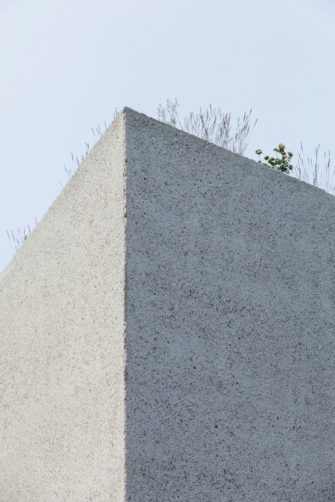 gray concrete wall under blue sky during daytime