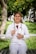 smiling woman in white long sleeve shirt with stethoscope on her neck