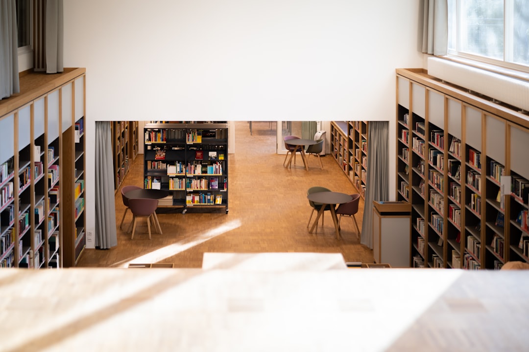 brown wooden book shelf near brown wooden table