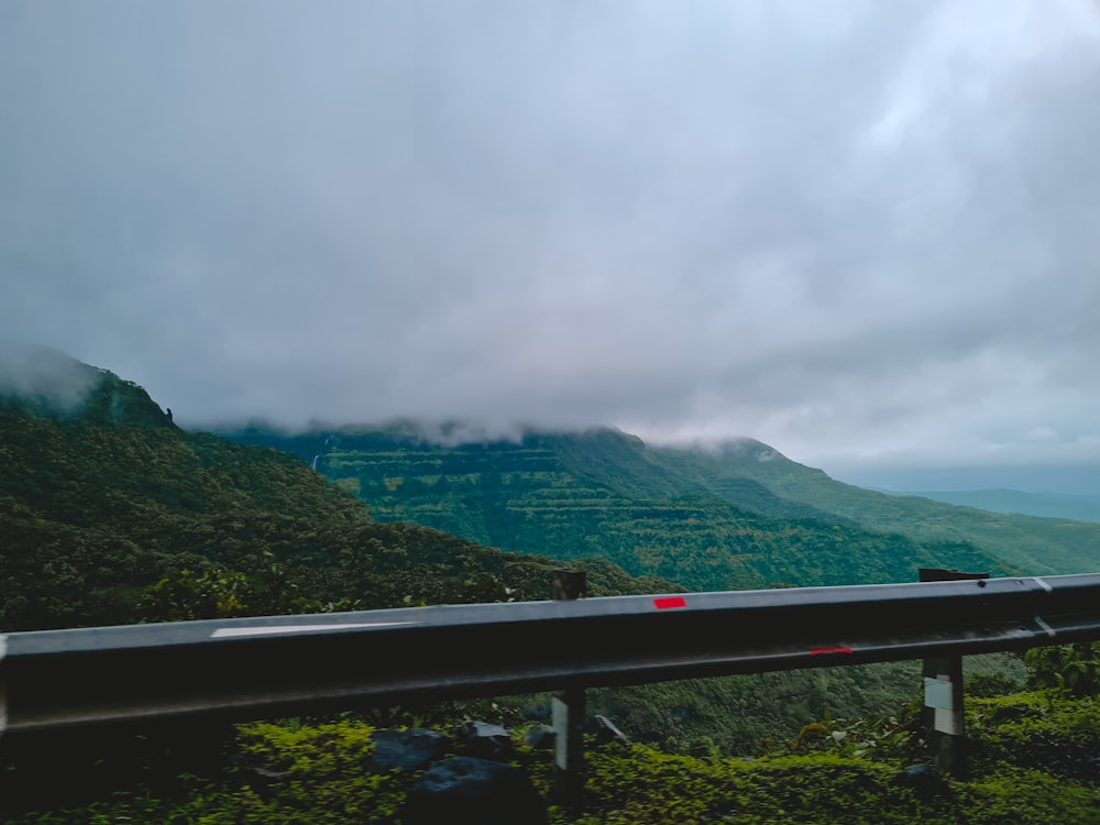 green mountains under white clouds during daytime