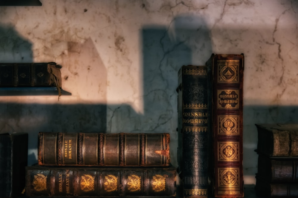 brown and black hardbound books