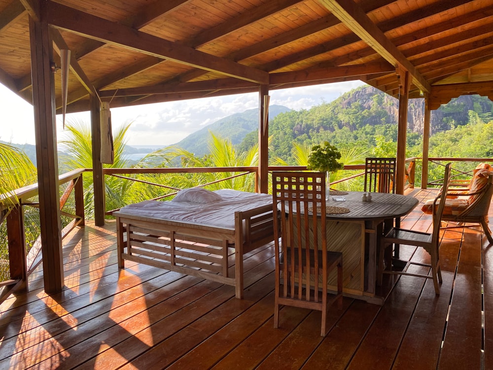 brown wooden table and chairs on brown wooden deck